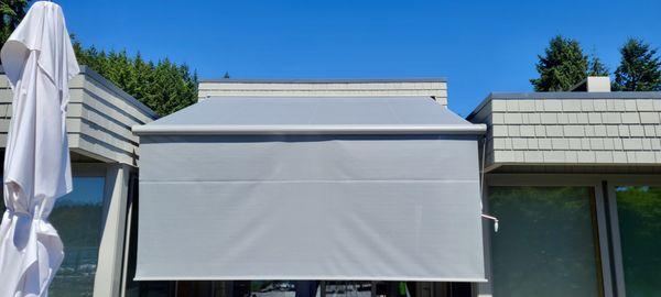 Markilux 6000 Retractable Awning with motorized drop screen.