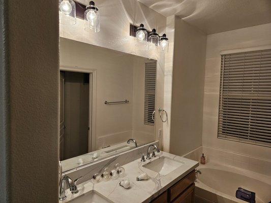 Main bathroom after Jean's remodel + new faucet/lights