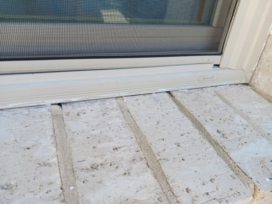 Window Caulk - We remove every bit of caulk that we can before resealing around windows.