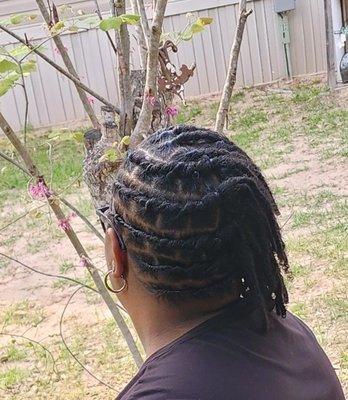 Loc retwist, maintenance and style! Beautiful job!