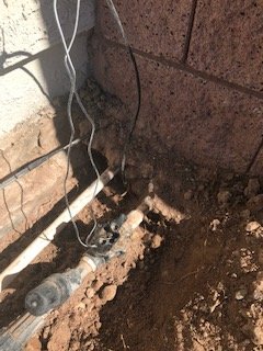 The pipe to protect the waterlines and allow service or repair shown in the other picture is not seen here and the water lines are cemented