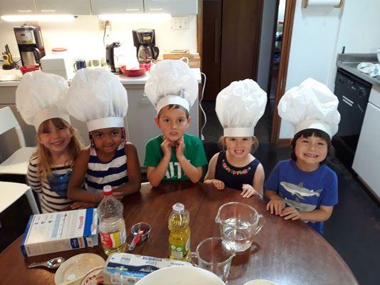 Our little chefs working on a cooking project!