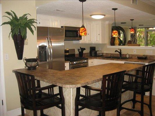 Kitchen with additional setting at the bar.