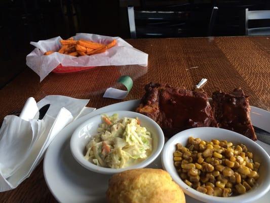 1/4 rack of St Louis-style ribs, corn, slaw, sweet potato fries, and cornbread.