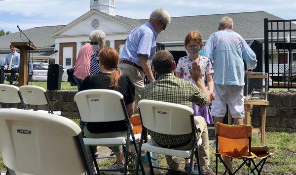 Finding a seat before out outdoor worship service with Bethel, Central, and Mount Zion United Methodist Churches.