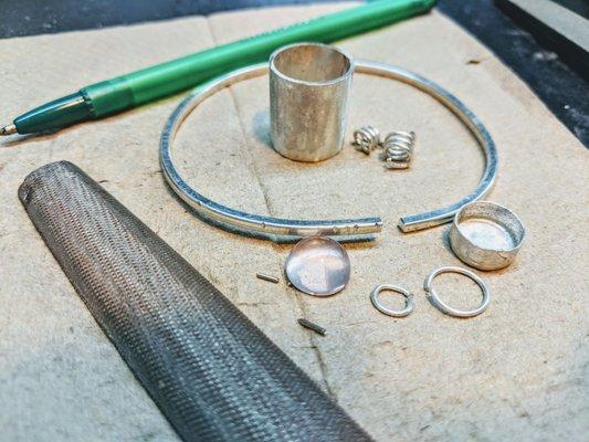 The ring and bangle bracelet coming along. A file tool to smooth out the excess metal from soldering the metal into a loop