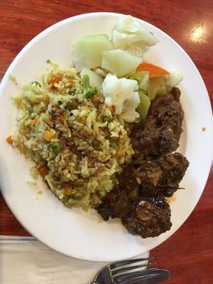 Oxtail with veggie rice and sides of eggplant and veggies