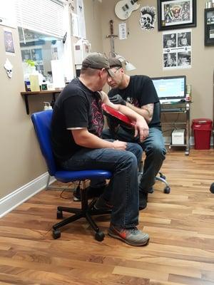 Adam giving my bil his fist tattoo!