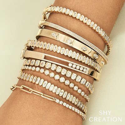 Create your own Shy Creation Gold and Diamond Bangle Bracelet Stack.  So many wears to customize your look.  Visit Park Jewelers, Lake Mary