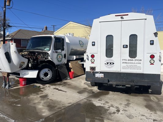 Radiator replacement on environmental services freight liner