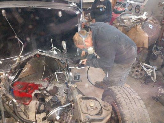 Cutting fenders of on a 1934 fired coupe.