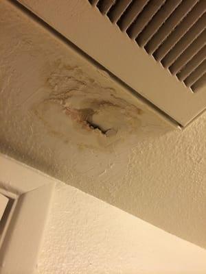 My ceiling after they've repaired it. This is what happens when you spackle wet sheet rock months later!