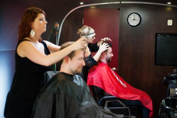 Groomsman and Groom getting their hair done before the wedding. Photo by Limelife Photography