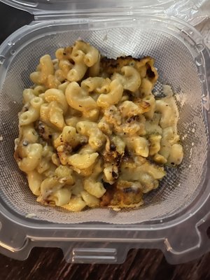 This is the macaroni cheese in the To Go container. No bites taken out of it at this time.