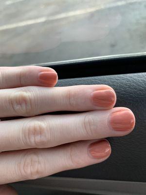 The polish does not cover the nail completely.