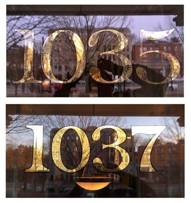 Recent transom gild. The top numerals are the original address numbers next door. The bottom numerals is newly gilded.