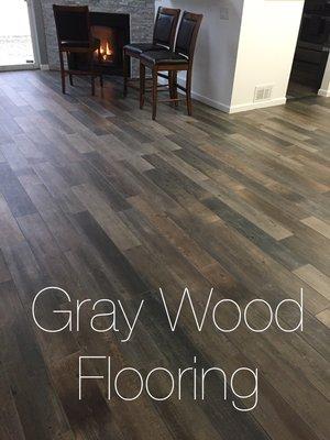 Vinyl gray wood flooring install. Looking to get your floor remodel will no further contact us for a estimate.