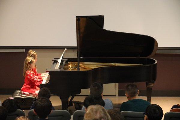 Sibling playing duet