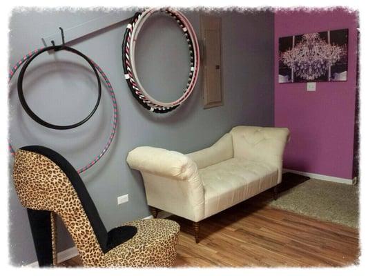 Our parlor features a beautifully textured fainting couch, leopard printed high heel shoe chair, & ample storage space.