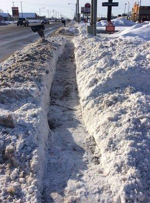 Emergency trails cut down S. Centerville road after sidewalks became buried in thick snow and ice from interstate plow trucks.