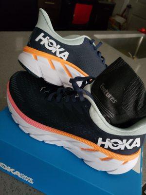 Hoka shoes and feeture socks.