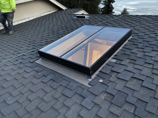 Installed new Velux skylight over new opening and waterproofed to existing presidential shingle roof system.