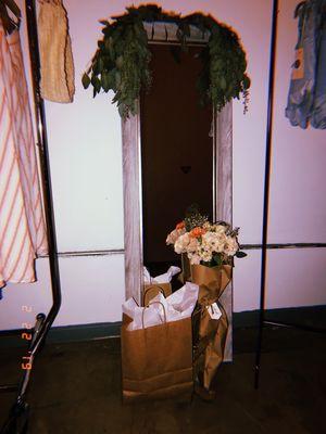 Customer clothing + bouquet purchase.