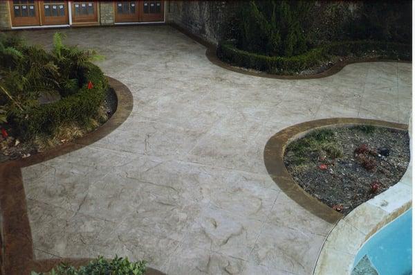 Stamped concrete patio with accent ribbons