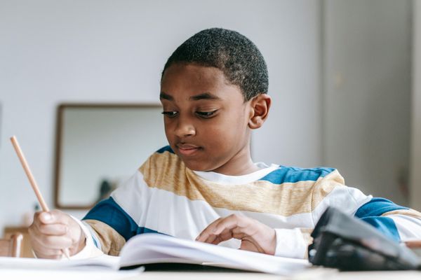 Student completing SHSAT test prep practice questions during a group lesson held at the Ace It Academics tutoring center in Brooklyn.