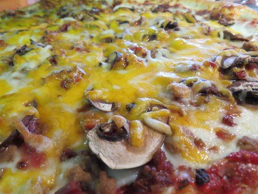 Delicious Bacon Mushroom Cheeseburger pizza with fresh cut Baby Bellas