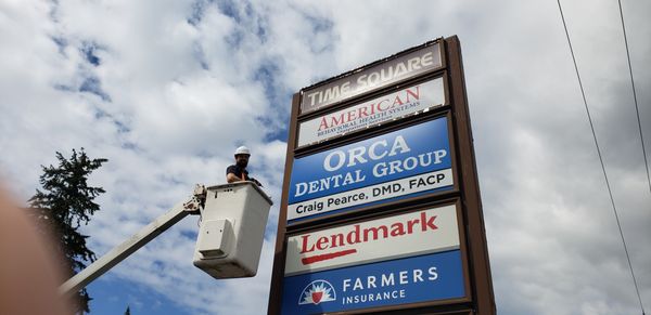 Boom truck services and backlit signs for your company