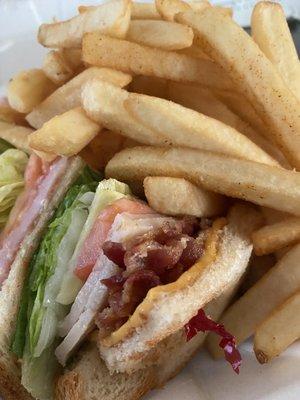 Club sandwich with fries