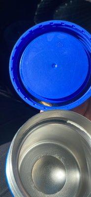 Used stinky thermos with rotting food in the lid