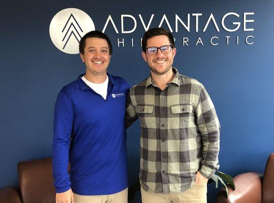 Dr. Zach and Dr. Evan standing in their office in New Berlin.