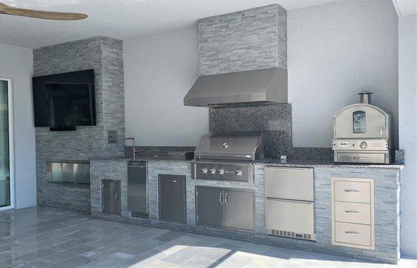 Fireplace, Pizza Oven & Awesome grill, hood and more.