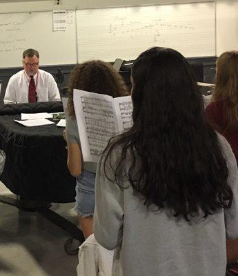 Patrick Taylor, Music Director at Greenwich High School, rehearsing for November Greenwich Symphony concert.