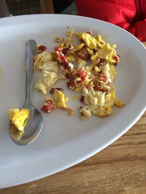 The not even warm scrambled eggs and bacon.