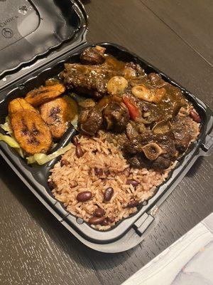 Oxtail is amazing Rice and Peas Fried Plantain Steamed Vegetable