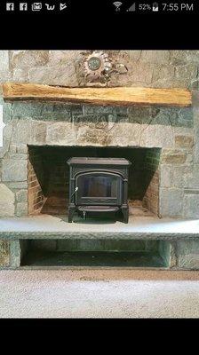 Hearthstone Wood Stove installed into a beautiful stone fireplace!