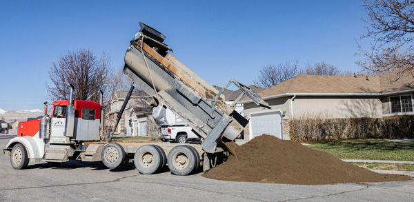 Topsoil delivery for grading and sod install