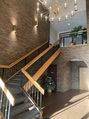 Main entrance staircase (elevator by archway)