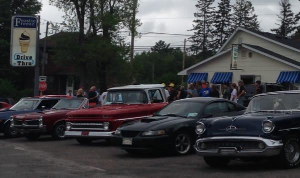 Car fans stopping at the Frostie Freeze while on a cruise during the annual Cue Master's car show.