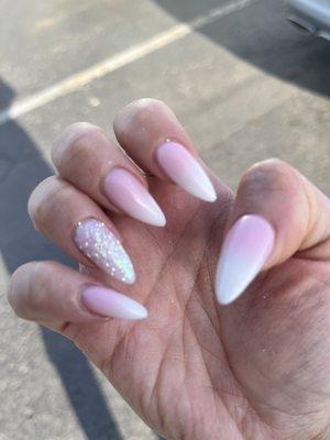 Pink and white nails with glitter accent