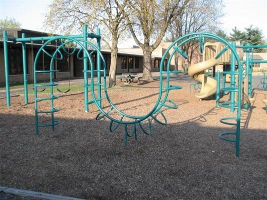 Climbing M in "green" playground by school