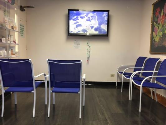 Seating / waiting area. Spacious and comfy. The a/c and tv makes me wanna nap LOL.