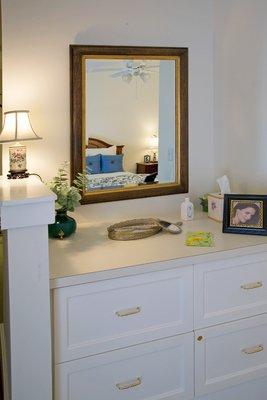 Built-in cabinets inside the Assisted Living bedroom offer secured storage.