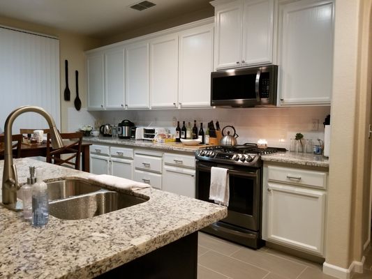 Pearl white cabinets; but did the island cabinets black to change it up a little.. looks so good!