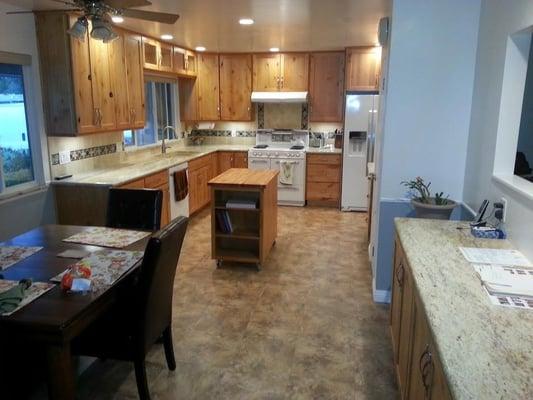 Knotty alder cabinets, new pass through to living area.  Rebuilt vintage stove.