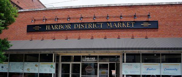 We are located inside the Harbor District Market