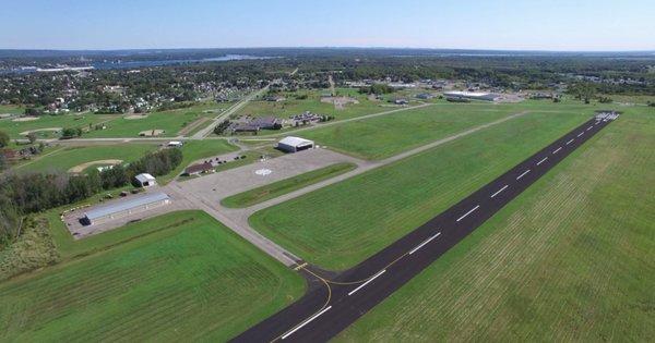 Aerial view of the runway and the surrounding city.